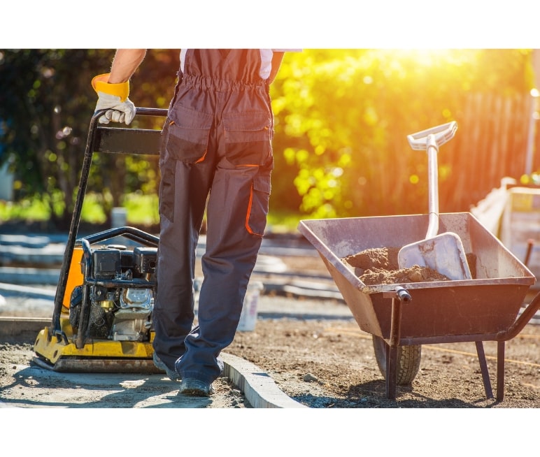 Contractor paving a driveway