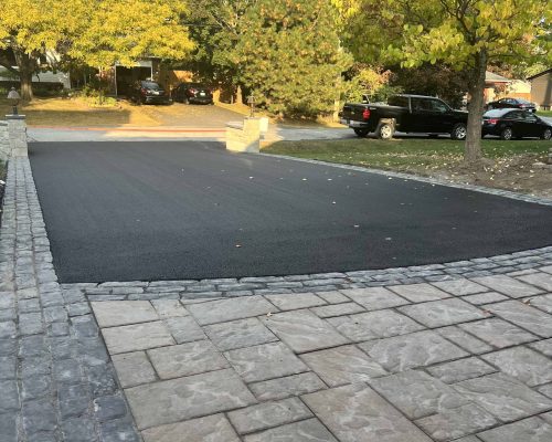 Asphalt driveway with interlock border completed by WCI Ottawa