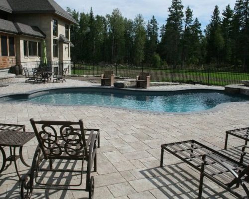 Residential backyard interlock patio and pool area in Ottawa