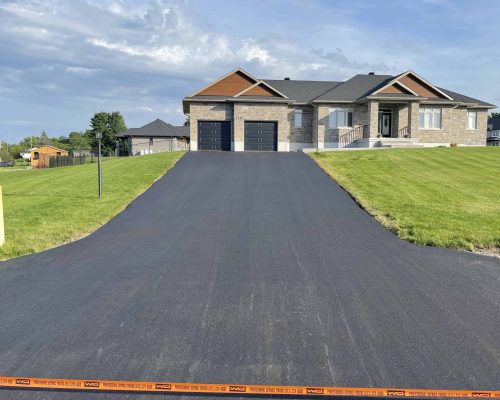 Long residential asphalt driveway paving project in Ottawa