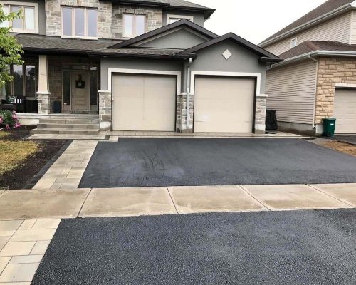 Newly paved asphalt driveway at Ottawa home
